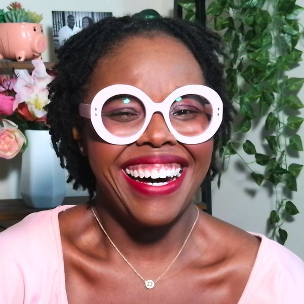 Jatoyia Armour, host of Bariatric Paths, smiling in pink glasses